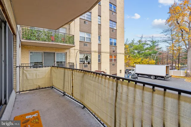 a view of a swimming pool with a balcony