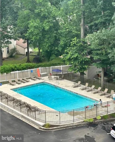 a view of a swimming pool with a patio