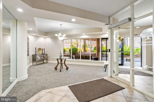 a living room with a couch and next to a window