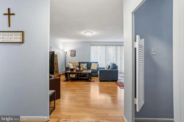 a bed room with furniture and a flat screen tv