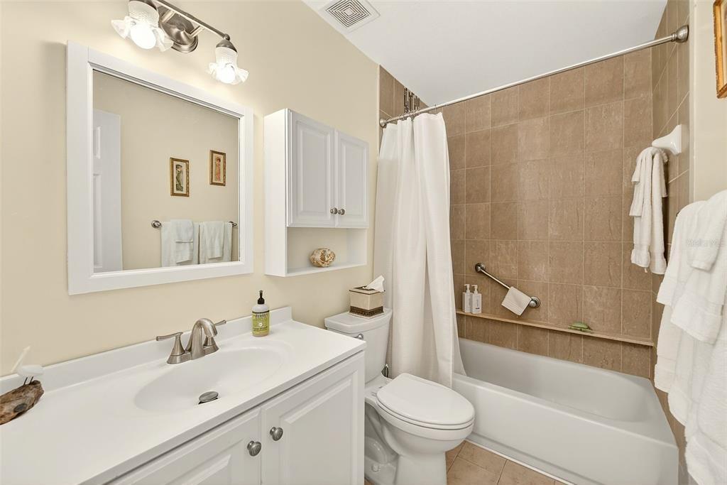 2064 Sunset Point Road, Unit 73 Clearwater, FL 33765 - Photo 31 of 58 a bathroom with a sink toilet and shower
