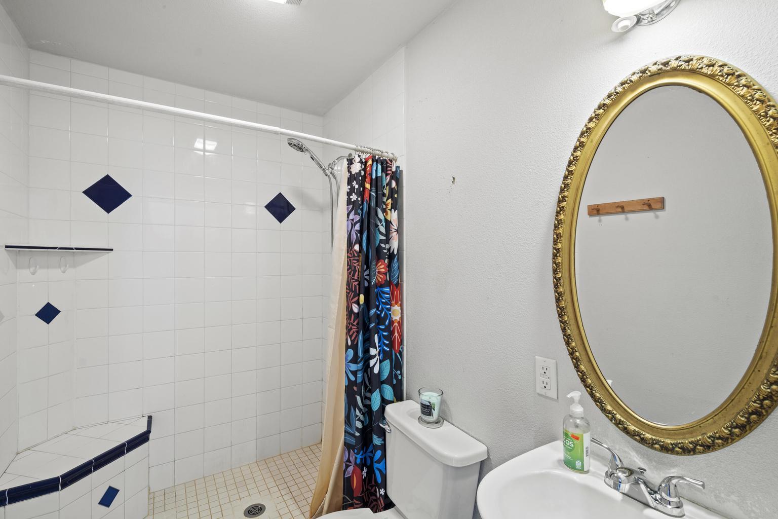 1190 Cedar Flat Road Williams, OR 97544 - Photo 19 of 45 a bathroom with a sink mirror toilet and shower