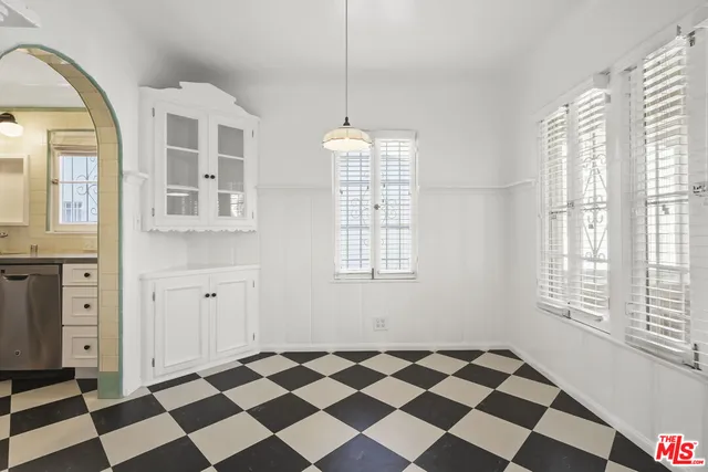 a kitchen with a sink and a microwave