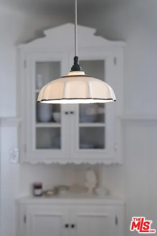 a view of a workspace with a window and dining table
