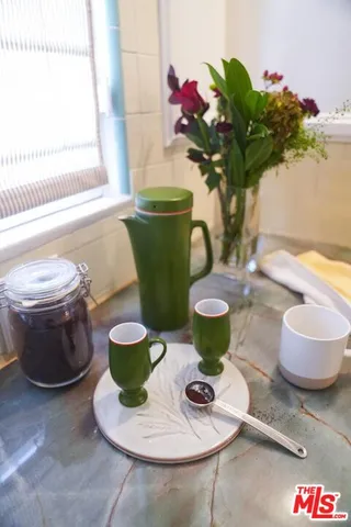 a large kitchen with stainless steel appliances granite countertop a sink and a stove