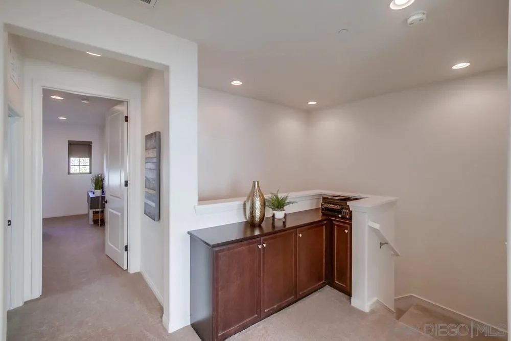 16629 Gill Loop San Diego, CA 92127 - Photo 14 of 25 a view of a hallway with a view of bedroom