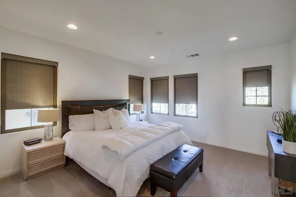 16629 Gill Loop San Diego, CA 92127 - Photo 15 of 25 a bedroom with a bed and a night stand