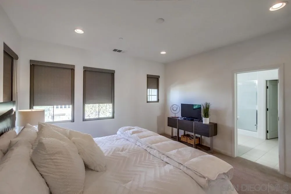 16629 Gill Loop San Diego, CA 92127 - Photo 16 of 25 a bedroom with a bed and wooden floor