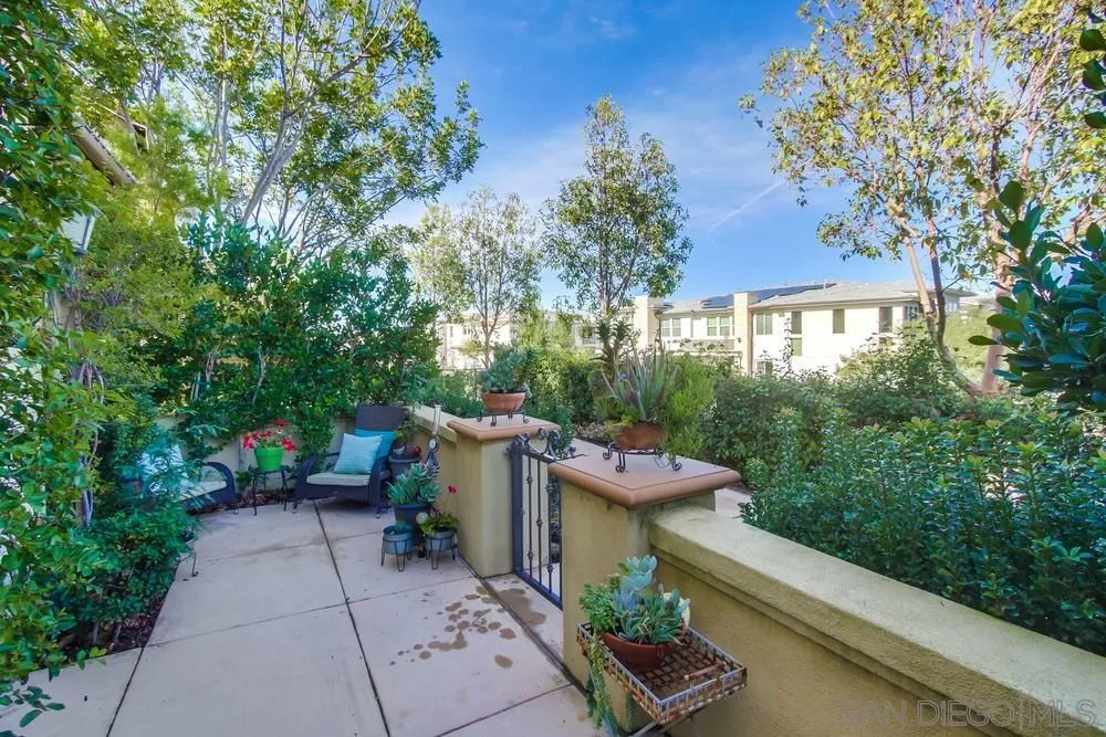 16629 Gill Loop San Diego, CA 92127 - Photo 23 of 25 a view of a patio with table and chairs and potted plants