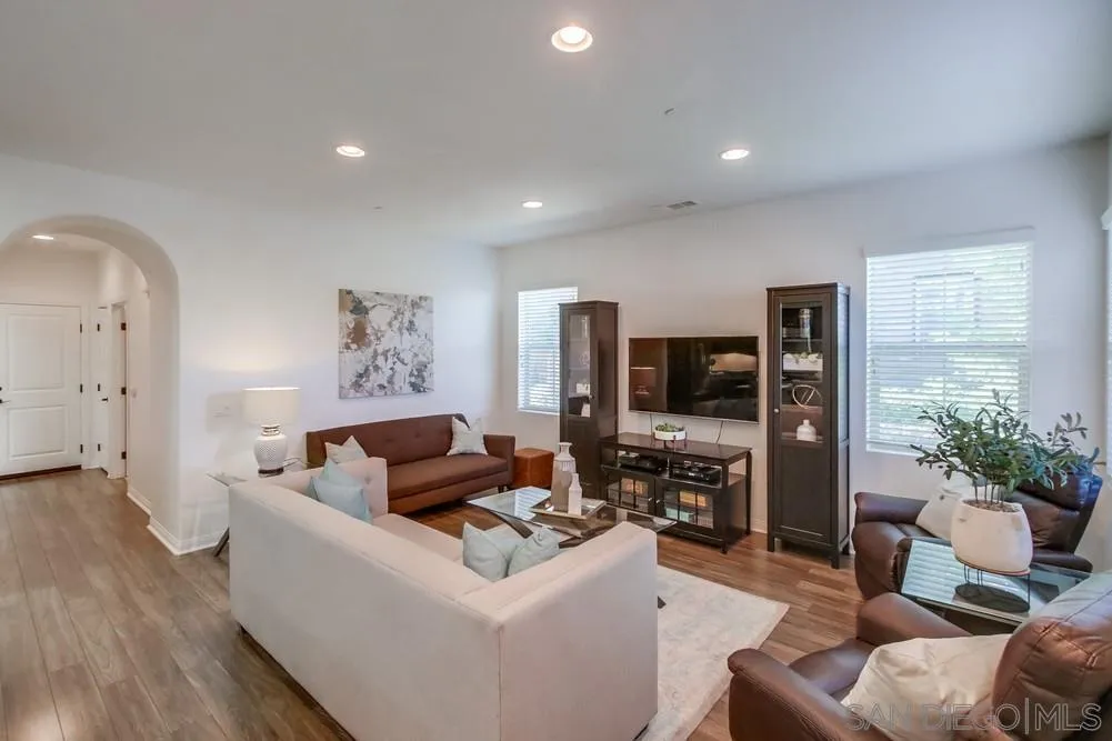 16629 Gill Loop San Diego, CA 92127 - Photo 4 of 25 a living room with furniture and a flat screen tv