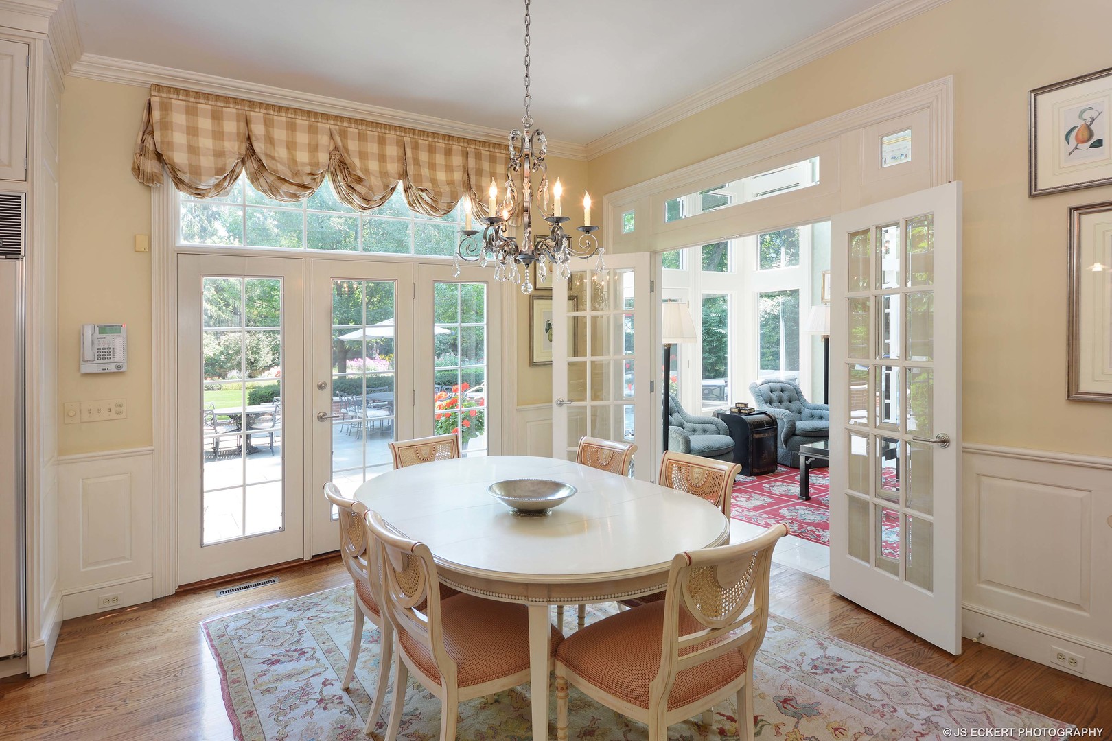 191 North Mayflower Road Lake Forest, IL 60045 - Photo 11 of 36 a view of a dining room with furniture large windows and wooden floor