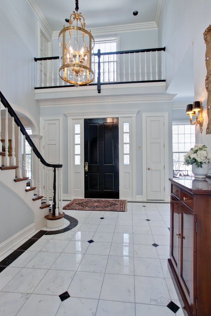 191 North Mayflower Road Lake Forest, IL 60045 - Photo 6 of 36 a view of an entryway with chandelier