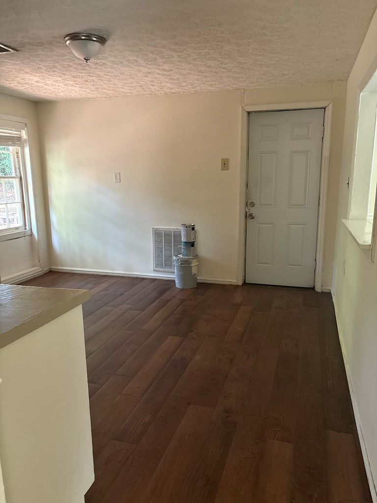 2910 Beech Street Columbus, GA 31909 - Photo 19 of 24 an empty room with wooden floor and windows