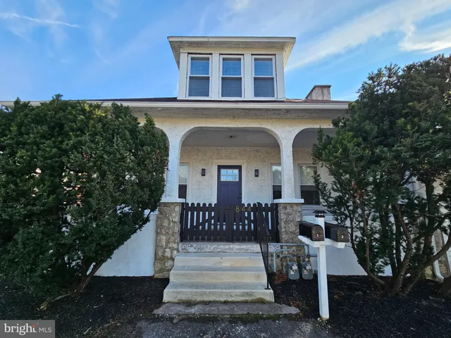 a front view of a house with a porch