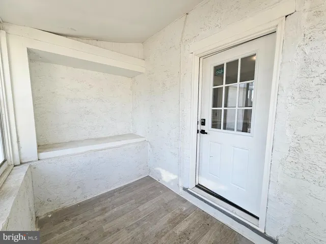 a view of a house with wooden stairs