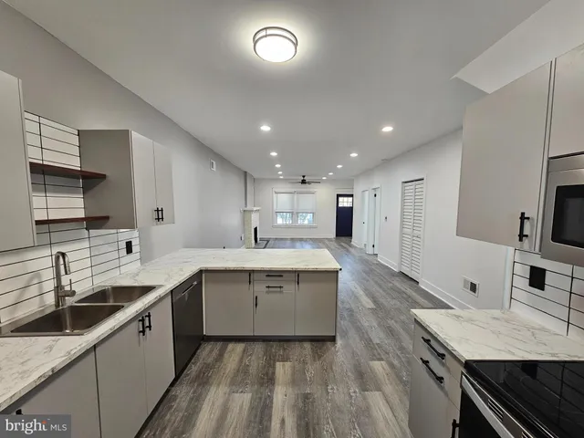 a kitchen with a sink and a refrigerator