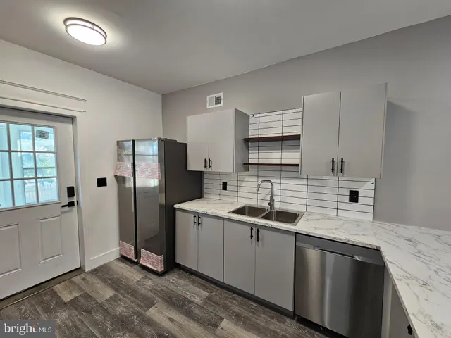 a kitchen with a stove and a microwave