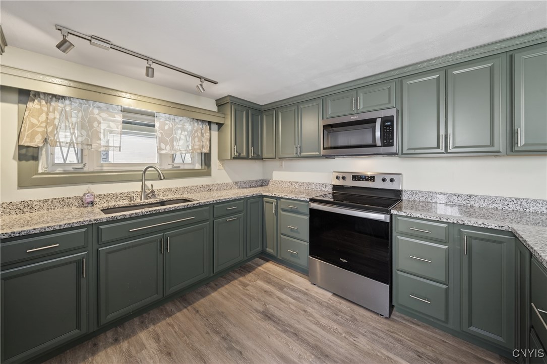 507 County Rte 12 Schroeppel, NY 13132 - Photo 19 of 50 Kitchen view, that window looks into the front sun