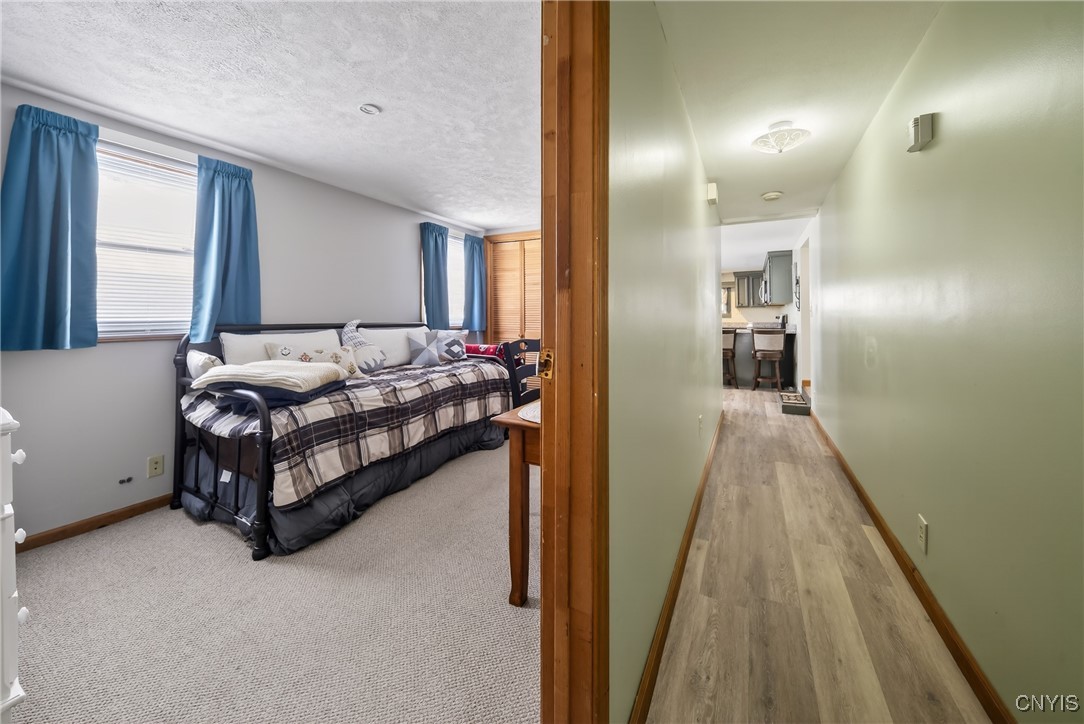 507 County Rte 12 Schroeppel, NY 13132 - Photo 20 of 50 The LVF continues down the long hallway to bedroom