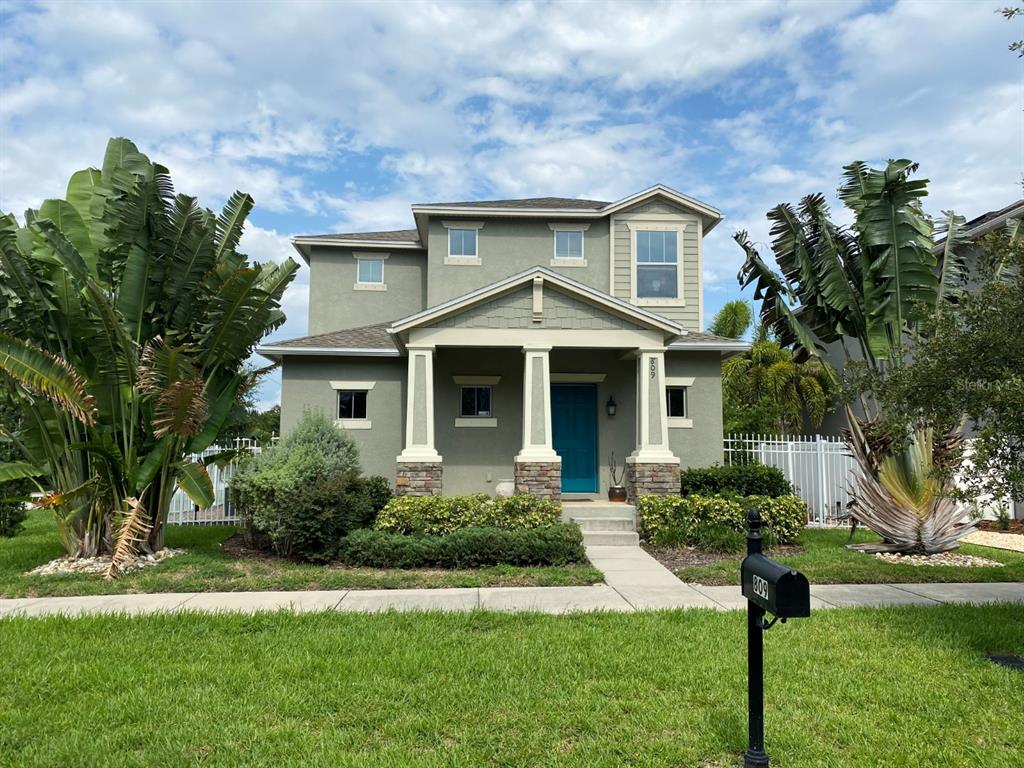 809 North Oregon Avenue Tampa, FL 33606 - Photo 1 of 16 a front view of a house with a yard