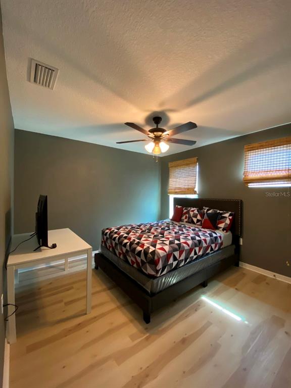 809 North Oregon Avenue Tampa, FL 33606 - Photo 11 of 16 a bedroom with a bed and window