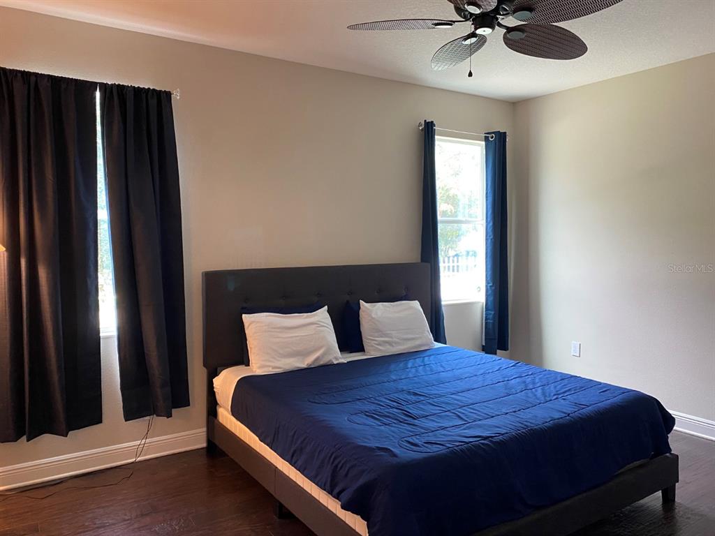 809 North Oregon Avenue Tampa, FL 33606 - Photo 6 of 16 a bedroom with a bed and window