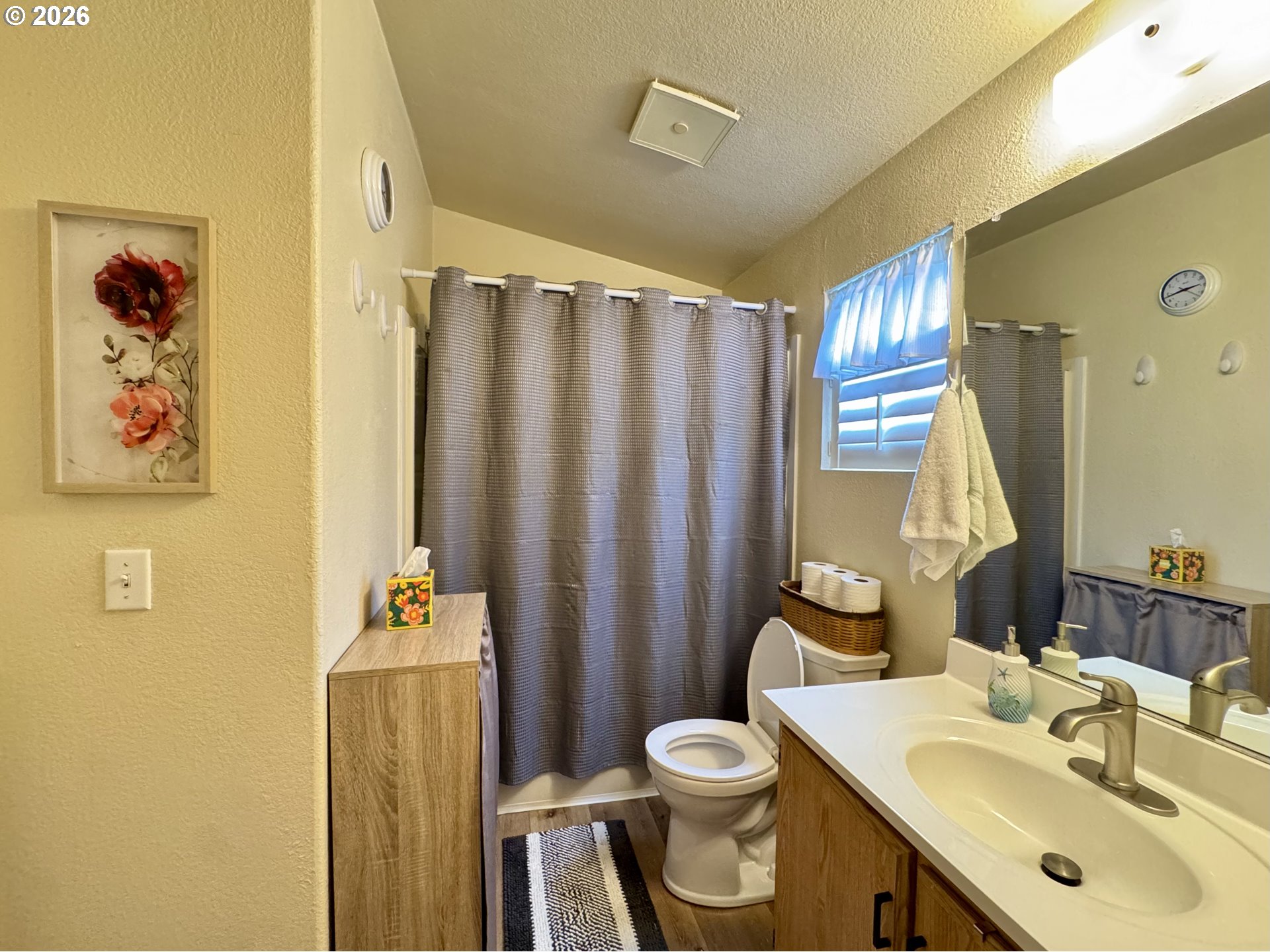 3760 Highway 101, Unit 1 Florence, OR 97439 - Photo 9 of 32 a bathroom with a sink toilet and shower