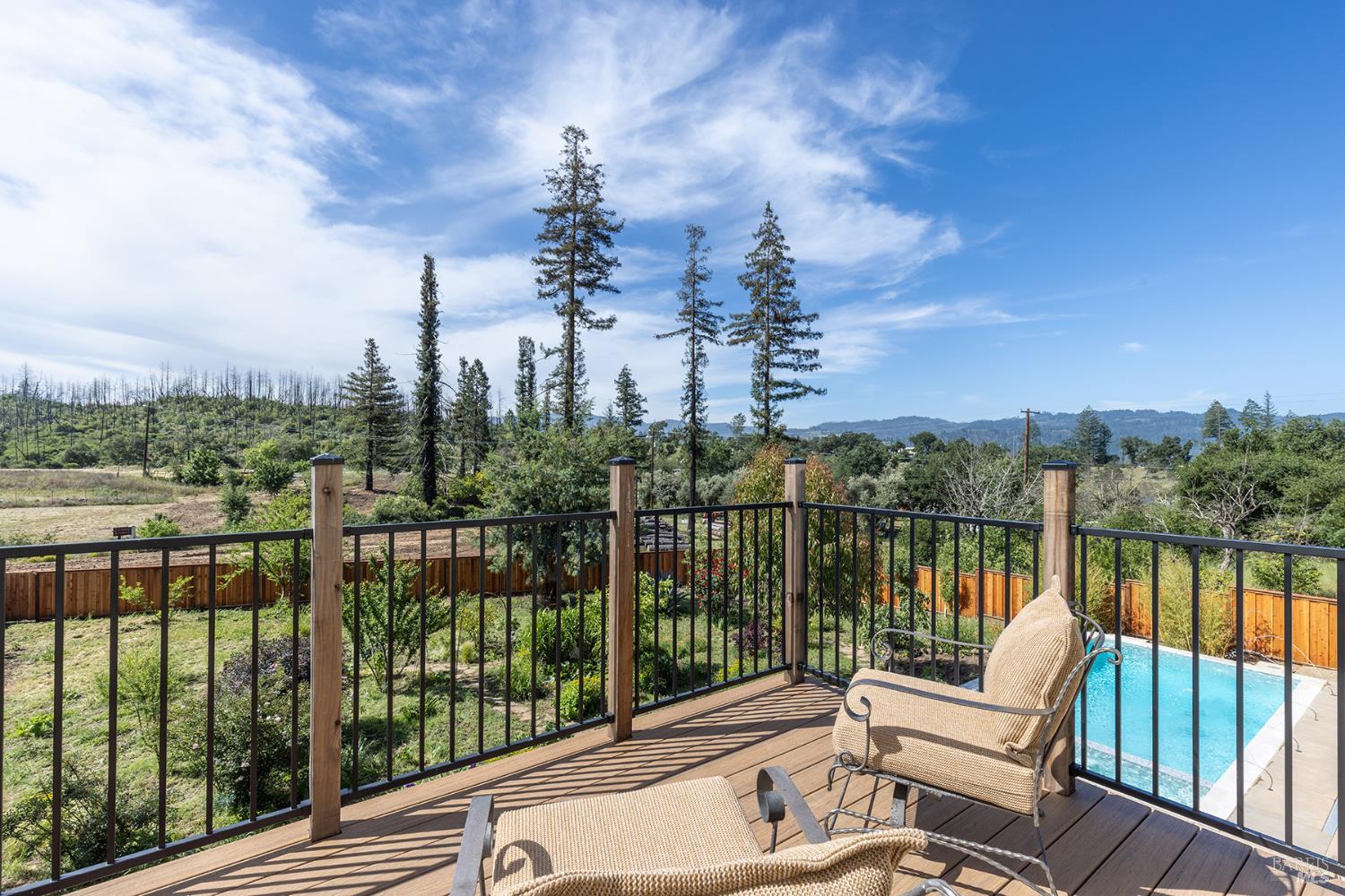 753 Sunnyside Road St. Helena, CA 94574 - Photo 39 of 55 a view of a balcony with lake view and wooden floor