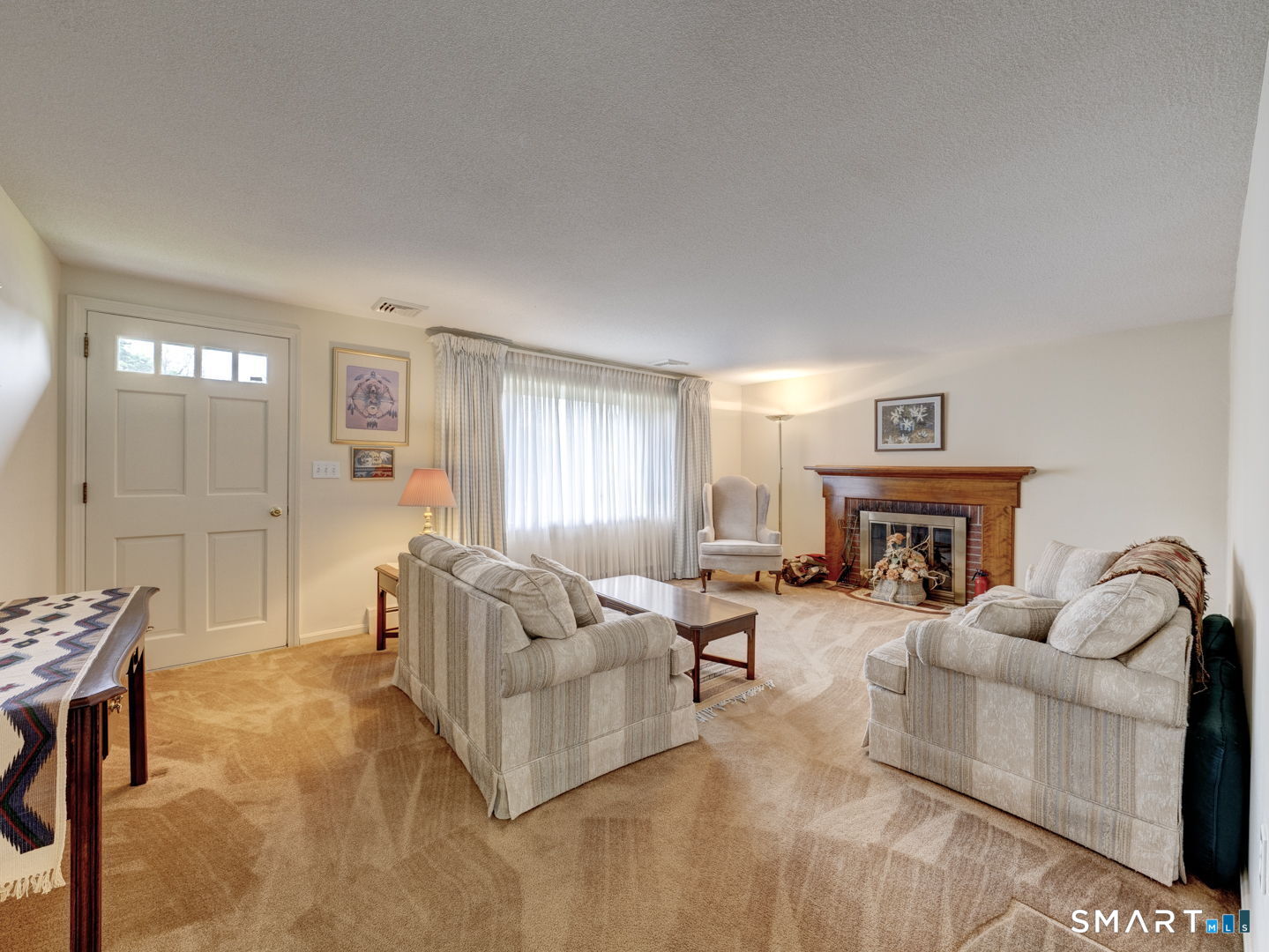 53 Goodwin Drive Somers, CT 06071 - Photo 4 of 22 a living room with furniture and a fireplace