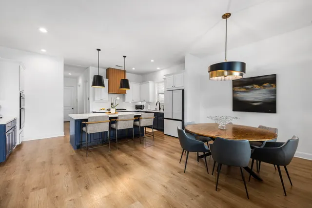 a kitchen with a sink a counter top space and stainless steel appliances