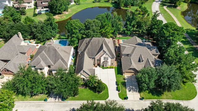 a living room with furniture a fireplace and a large window