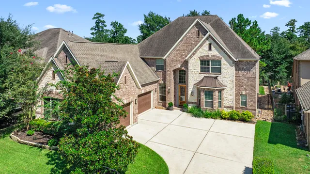 a aerial view of a house with a yard