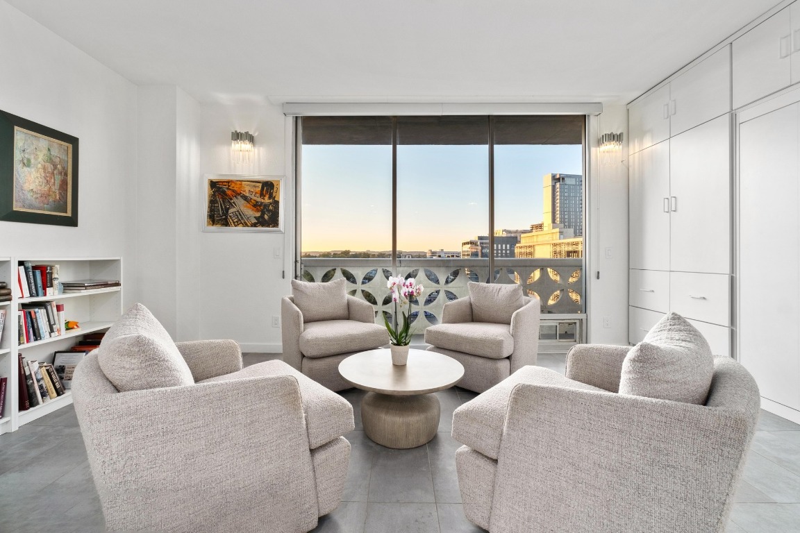 1801 Lavaca Street, Unit 7B Austin, TX 78701 - Photo 2 of 40 a living room with furniture and a large window