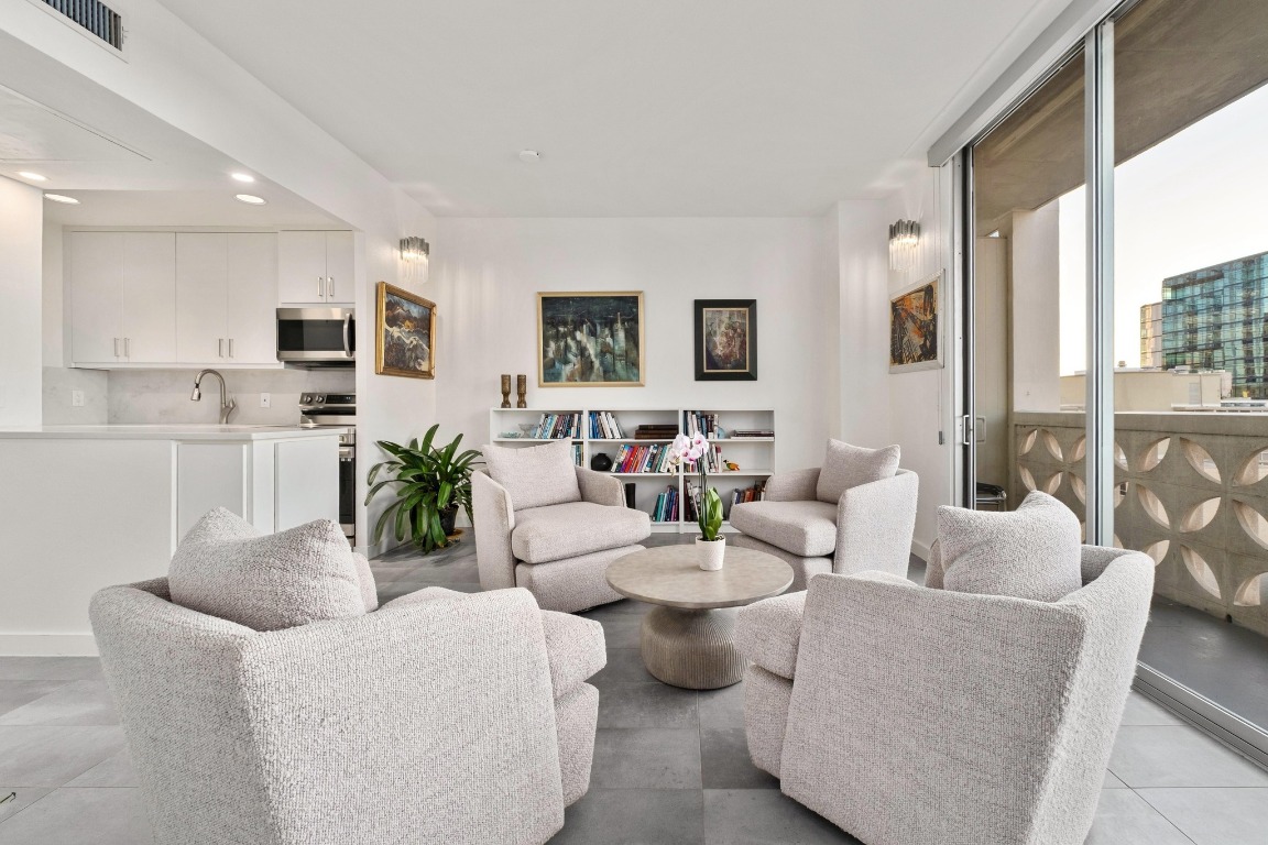 1801 Lavaca Street, Unit 7B Austin, TX 78701 - Photo 3 of 40 a living room with furniture and a flat screen tv