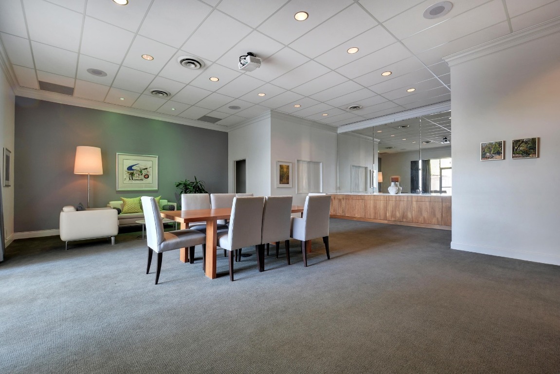 1801 Lavaca Street, Unit 7B Austin, TX 78701 - Photo 34 of 40 a living room with furniture and a wooden floor