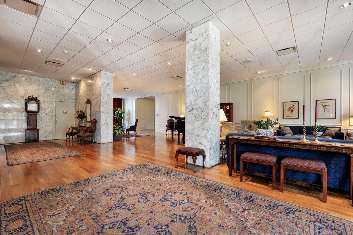 1801 Lavaca Street, Unit 7B Austin, TX 78701 - Photo 38 of 40 a lobby with furniture and a rug