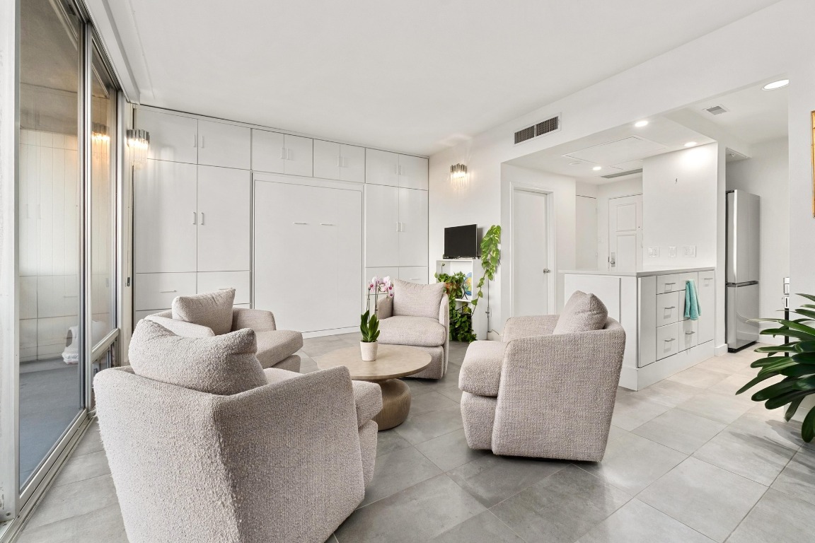 1801 Lavaca Street, Unit 7B Austin, TX 78701 - Photo 5 of 40 a living room with furniture and a large window