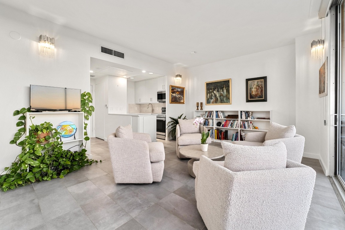 1801 Lavaca Street, Unit 7B Austin, TX 78701 - Photo 6 of 40 a living room with furniture and a couch