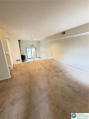 a view of empty room with windows