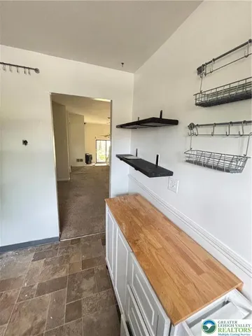 a kitchen with stainless steel appliances granite countertop a refrigerator and a stove