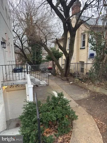 a view of a patio with table and chairs and couches