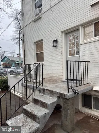 a view of a patio with a table and chairs