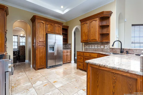 a kitchen with a sink stove and cabinets