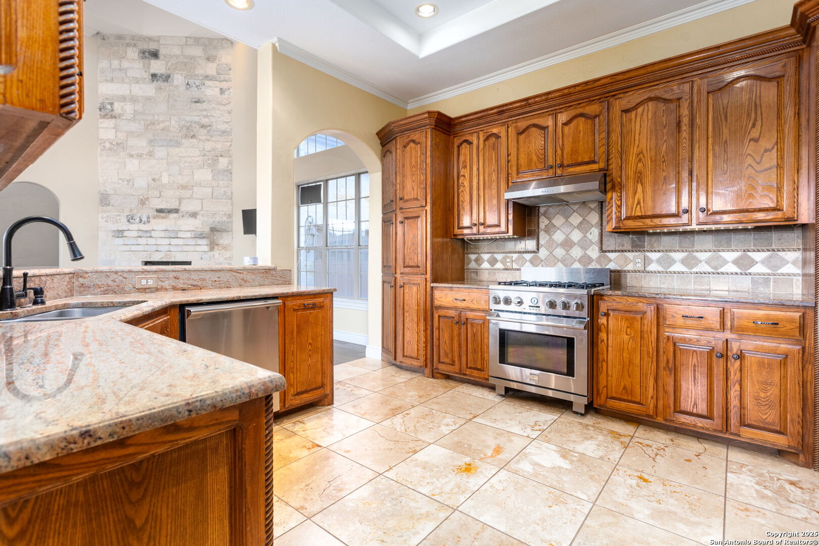 192 County Road 2812 Mico, TX 78056 - Photo 21 of 47 a kitchen with a sink stove and cabinets
