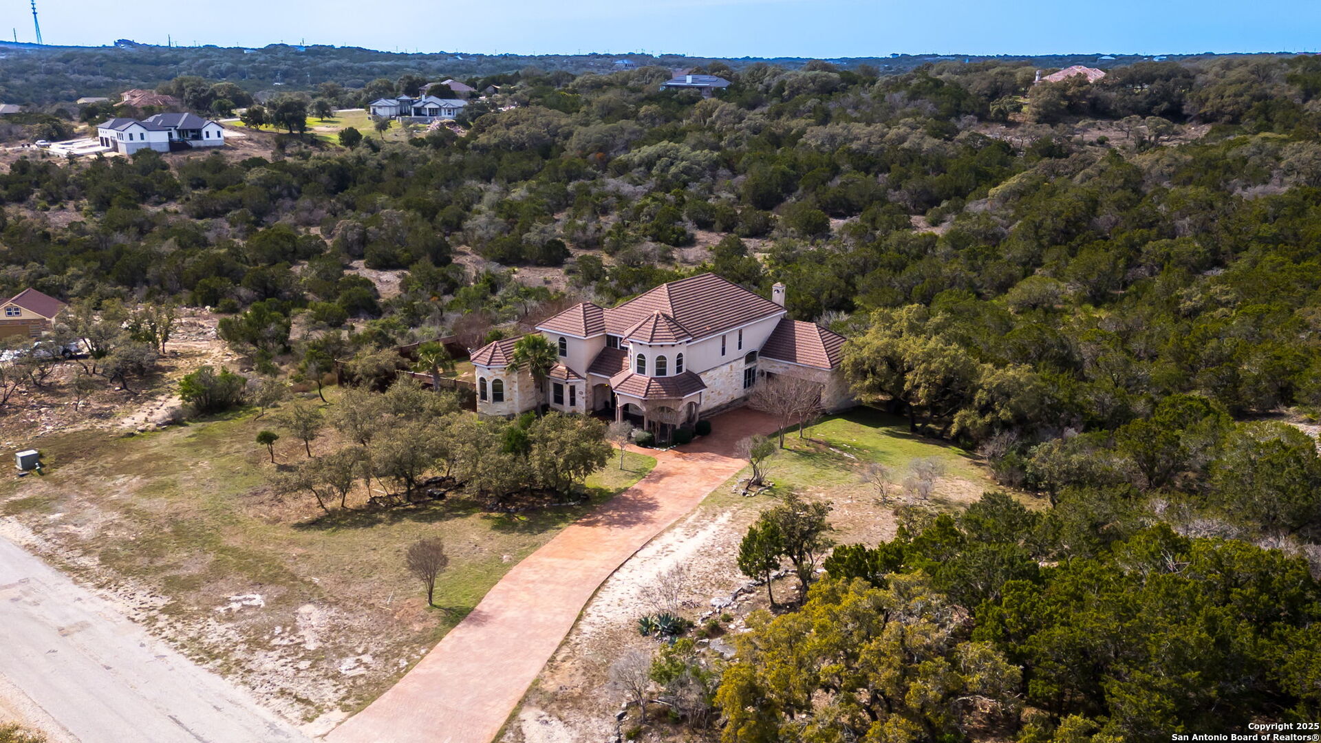 192 County Road 2812 Mico, TX 78056 - Photo 39 of 47 a aerial view of a house with a yard