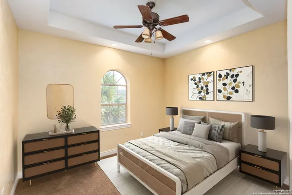 a bedroom with a bed and a large window