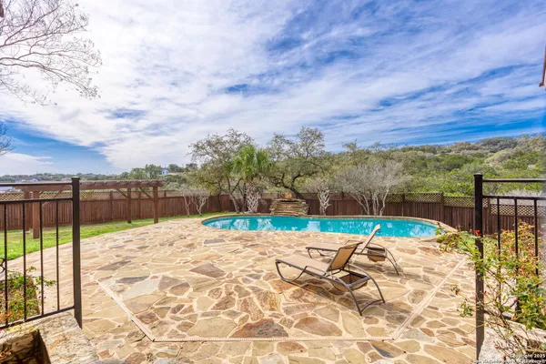 a view of swimming pool with a lounge chair
