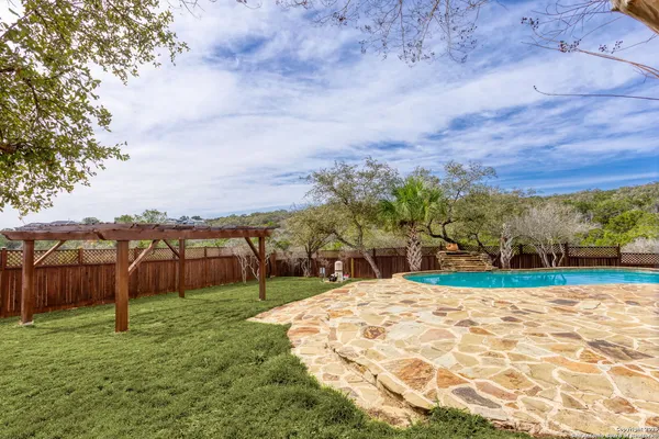 a view of swimming pool with a yard
