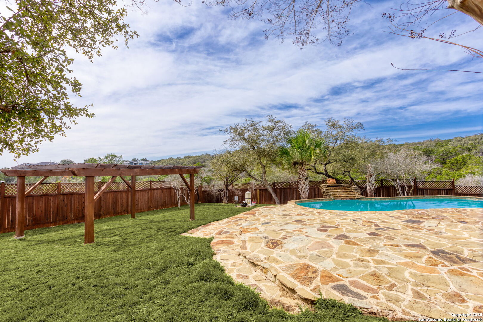 192 County Road 2812 Mico, TX 78056 - Photo 7 of 47 a view of swimming pool with a yard