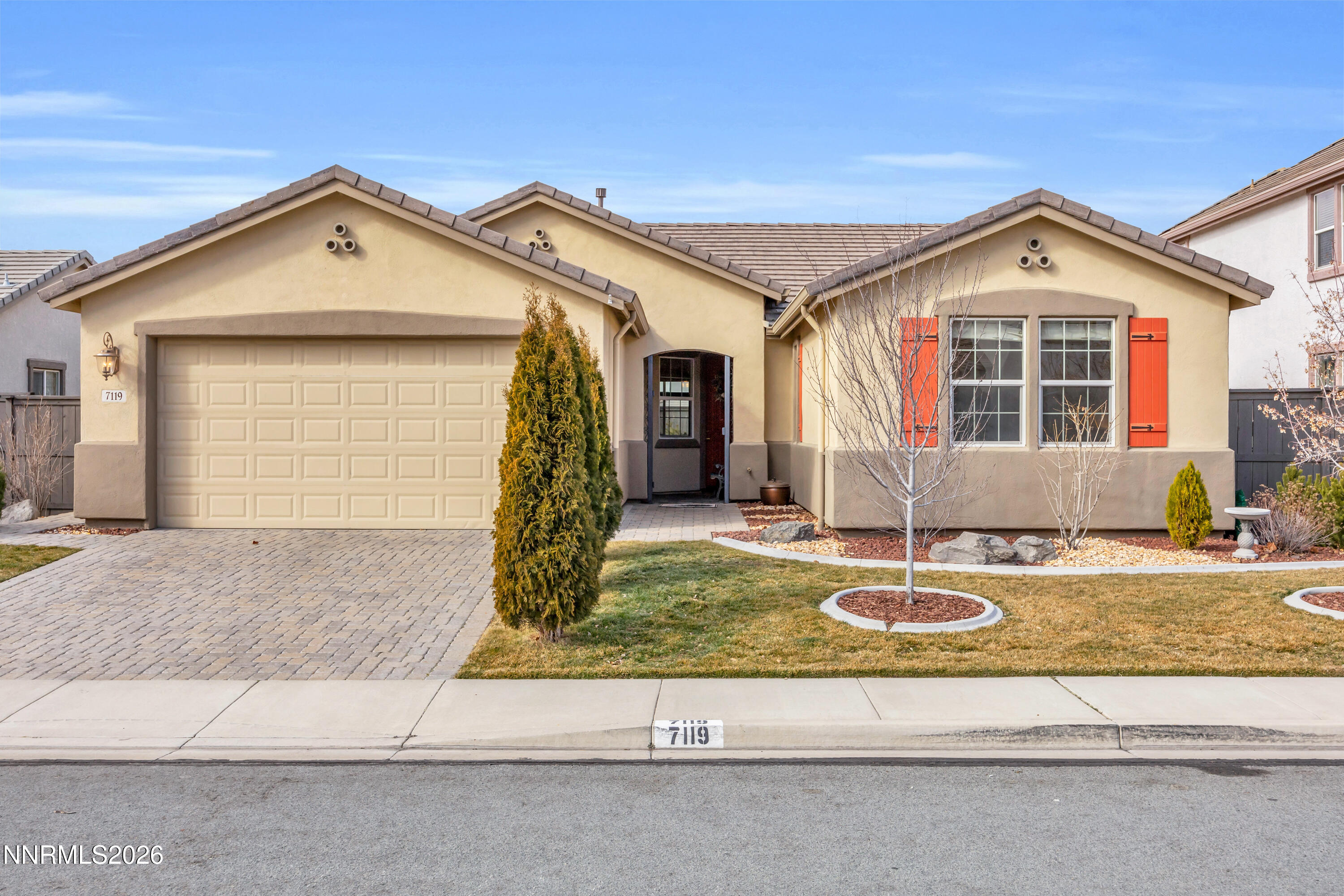 7119 Coldwater Street Sparks, NV 89436 - Photo 13 of 45 a front view of a house with garden